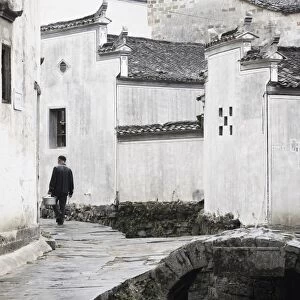 Man walking in the street, Xi Di (Xidi) village, UNESCO World Heritage Site
