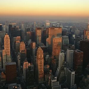 The Manhattan skyline at dusk, including the Chrysler Building, viewed from the Empire State Building, New York City, United States of America