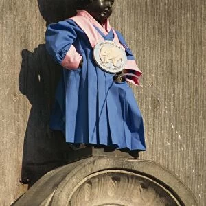 Manneken Pis statue dressed in garb of Brotherhood of Red Elephant, a brewery charity
