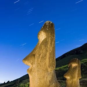 Maoi statues at Rano Raraku, illuminated at dusk, Easter Island (Rapa Nui), UNESCO World Heritage Site, Chile, South America