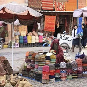 Market trader on hat stall, Marrakech, Morocco, North Africa, Africa