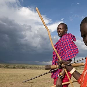 Masai boy with his father, Masai Mara, Kenya, East Africa, Africa