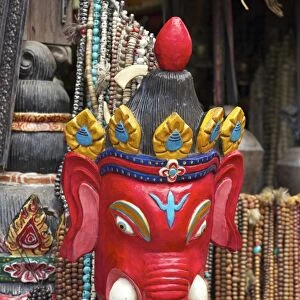 Mask of Ganesha, a Hindu god, on sale at Swayambhunath Stupa (Monkey Temple), Kathmandu, Nepal, Asia