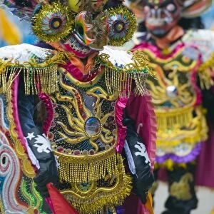 Masked performers in a parade at Oruro Carnival, Oruro, Bolivia, South America