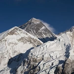The massive black pyramid summit of Mount Everest seen from Kala Patar with Nuptse