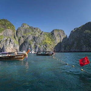 Maya Bay The Beach with long-tail boats and tourists, Phi Phi Lay Island, Krabi Province