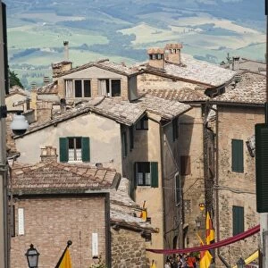 Medieval street decorated with local area flags, Montalcino, UNESCO World Heritage Site, Val d Orcia, Tuscany, Italy, Europe