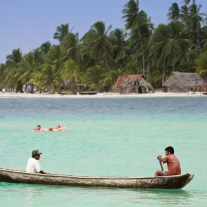 Men in dugout canoe near Devil Island, Comarca de Kuna Yala, San Blas Islands