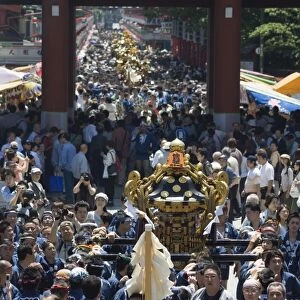 Mikoshi portable shrine of the gods parade and crowds of people