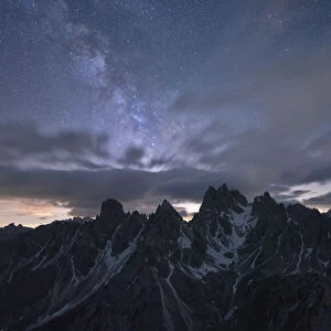 Milky Way and stars over the sharp pinnacles of Cadini di Misurina, Dolomites