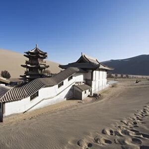 Ming Sha sand dunes and pavilion at Crescent Moon Lake, Dunhuang, Gansu Province