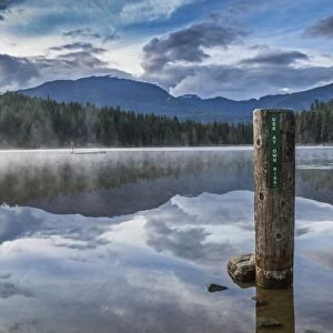 Mist on Lost Lake, Ski Hill and surrounding forest, Whistler, British Columbia, Canada
