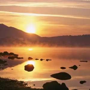 Mist rising on Derwent Water at sunrise, Lake District National Park, Cumbria