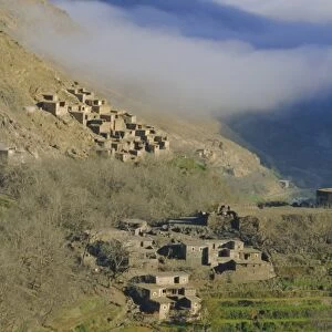 Mist rising above a village in the High Atlas mountains