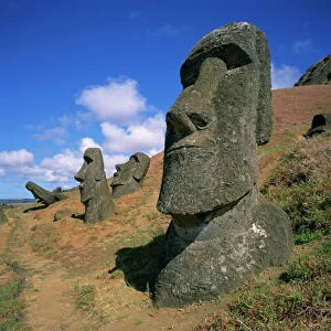 Moai statues carved from crater walls, on the southern slopes of Volcan Rano Raraku