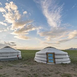 Mongolian nomadic traditional gers and clouds in the sky, Middle Gobi province, Mongolia