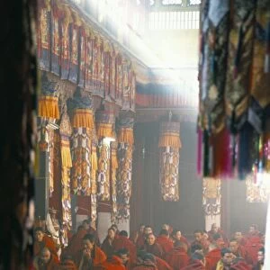 Monks inside the main prayer hall, Drepung Buddhist monastery, Lhasa, Tibet, China, Asia