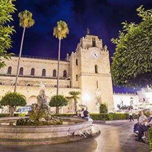 Monreale Cathedral at night, Sicilian people at the fountain in Guglielmo Square, Monreale, near Palermo, Sicily, Italy, Europe