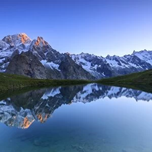 Mont Blanc reflected in Lac Checrouit (Checrouit Lake) at sunrise, Veny Valley, Courmayeur