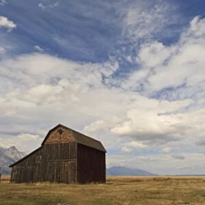 Mormon Row barn under a big sky in autumn (fall), Antelope Flats, Grand Teton National Park, Wyoming, United States of America, North America