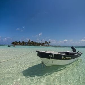 Motorboat anchoring in the turquoise waters of El Acuario, San Andres, Caribbean Sea