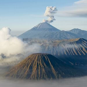 Mount Bromo, a volcano reaching 2392m, and Mount Semeru at 3676m early in the morning