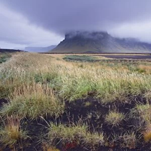 Mount Lomagnupur, 767 m, near Nupsstadur is a remarkable landmark above the flat black sand expanses of Skeidararsandur, south-east Iceland (Austurland), Iceland
