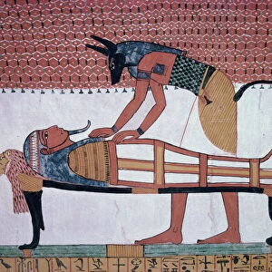 Mural showing the god Anubis leaning over mummy of Ramses II, in the Tomb of Sinjin