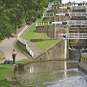 Narrow boat entering the bottom lock of the five lock ladder on the Liverpool Leeds canal