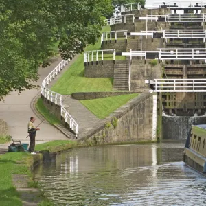 Narrow boat entering the bottom lock of the five lock ladder on the Liverpool Leeds canal