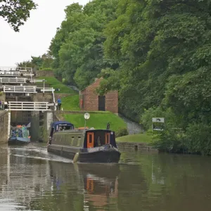 Narrow boats on the Liverpool Leeds canal, negotiating the five lock ladder at Bingley