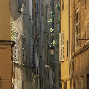Narrow sunlit street in Old Aix, Aix-en-Provence, Bouches-de-Rhone, Provence-Alpes-Cote-d Azur