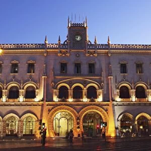 The Neo-Manueline facade of Rossio railway station, at night, in the Baixa district of Lisbon, Portugal, Europe