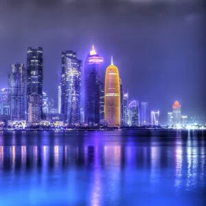 New skyline of the West Bay central financial district of Doha, illuminated at dusk, Qatar, Middle East