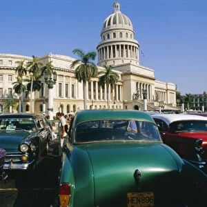 Old 1950s American cars outside El Capitolio Building, Havana, Cuba