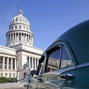 Old American car parked near the Capitolio building, Havana, Cuba, West Indies