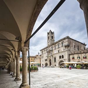 The old arcades frame the historical buildings of Piazza del Popolo, Ascoli Piceno