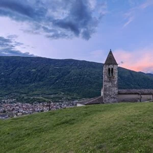 Old bell tower of the Xenodochio of Santa Perpetua at sunrise, Tirano, province of Sondrio