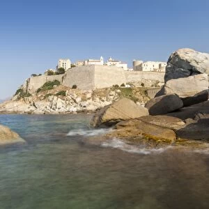 The old fortified citadel on the promontory surrounded by the clear sea, Calvi, Balagne Region