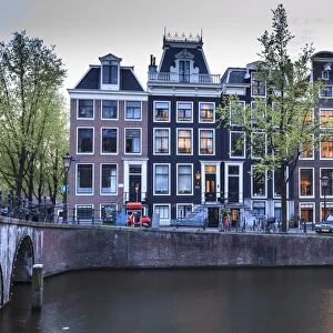Old gabled houses line the Keizersgracht canal at dusk, Amsterdam, Netherlands, Europe