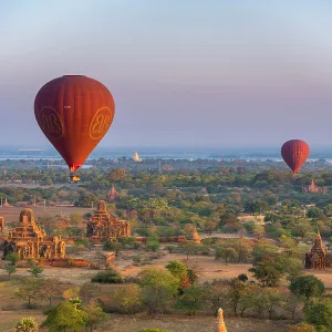 Old temples in Bagan and hot-air balloons before sunrise, Old Bagan (Pagan), UNESCO World Heritage Site, Myanmar (Burma), Asia