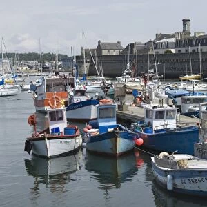 The old walled town of Concarneau seen from the fishing harbour, Southern Finistere