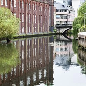 Old Warehouse reflected in the River Wensum, Norwich, Norfolk, England, United Kingdom, Europe