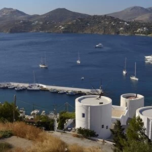 Old windmills, restored as holiday accommodation above Panteli harbour, Leros, Dodecanese Islands