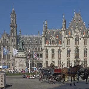 An open carraige awaits passengers on the Market Square in front of the Provincial Court Building, Brugge, UNESCO World Heritage Site, Belgium, Europe