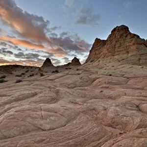 Orange clouds at sunrise above sandstone formations, Coyote Buttes Wilderness, Vermillion Cliffs National Monument, Arizona, United States of America, North America