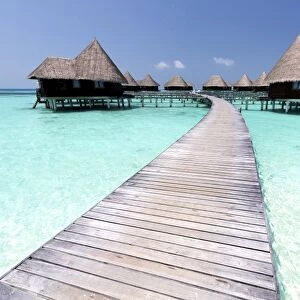 Over-water villas, crystal clear sea and blue sky, Coco Palm, Dhuni Kolhu, Baa Atoll