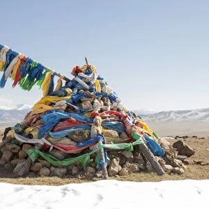 An ovoo, traditional place of worship in the middle of the Mongolian countrtyside