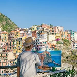 A painter at Manarola, Cinque Terre, UNESCO World Heritage Site, Liguria, Italian Riviera
