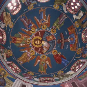 Paintings of Christian figures including Christ, in vibrant colours on the ceiling of the dome in the interior of St. Georges Church in Paphos, west of the island, Cyprus